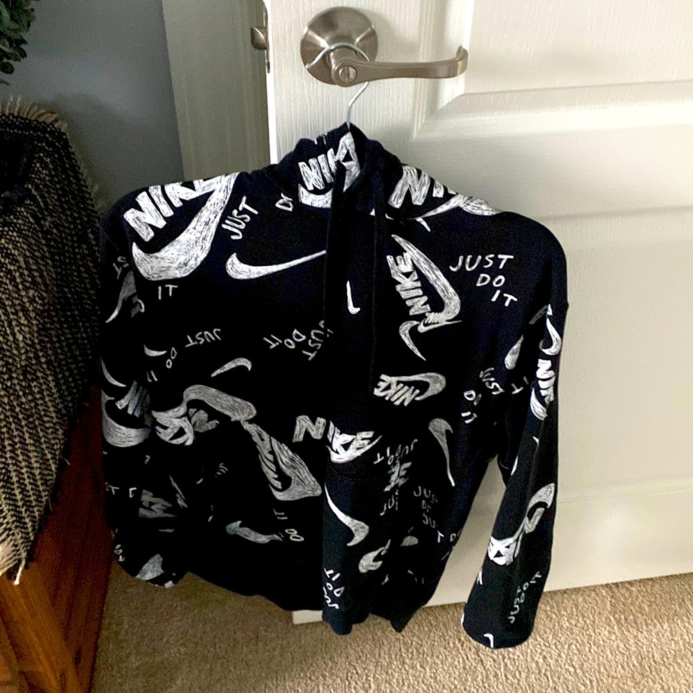 This is a black and white Nike hoodie size large